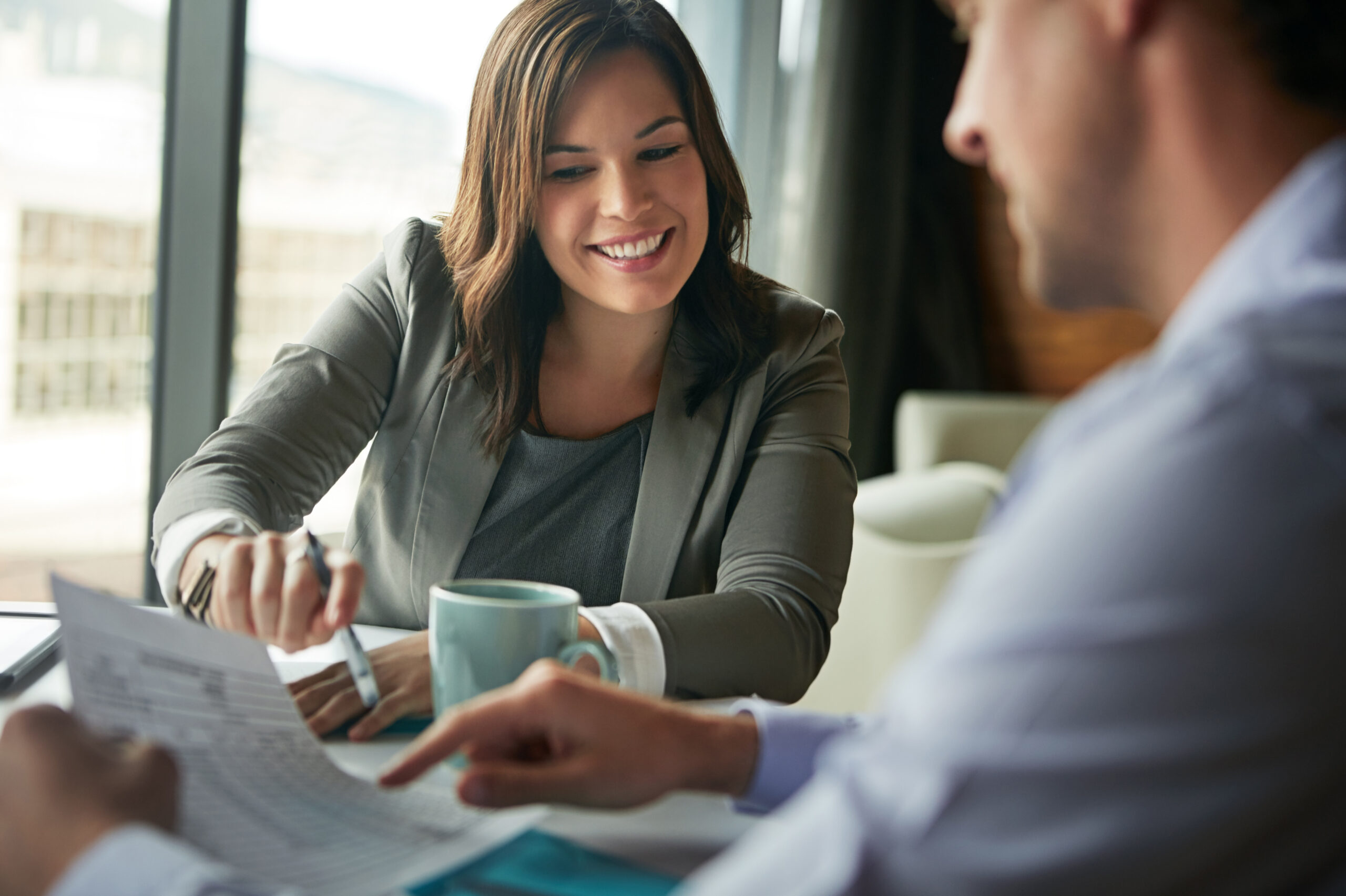 Professional adviser smiling during a client meeting